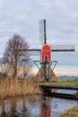 Traditional red wip windmill,Holland landscape Royalty Free Stock Photo